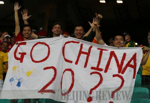 EXPECTATION: Chinese football fans hold a banner to express their hopes for the future of the sport in the country during a quarter-final game at the World Cup on July 5, 2014, in Brazil (XINHUA) 