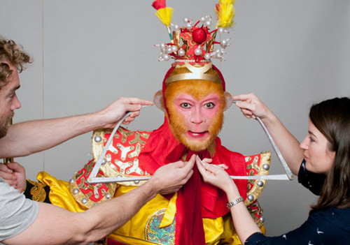 The professionals at Madame Tussauds measure and survey the body of actor Zhang Jinlai while he wears his iconic Monkey King costume. (Photo courtesy of Madame Tussauds Beijing)