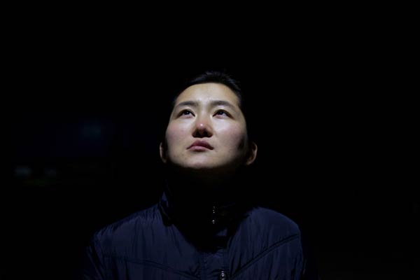 Jin Weikun, who had unsuccessful plastic surgery in South Korea, hopes her story will provide a lesson for potential patients. (Photo by Feng Zhonghao/For China Daily)