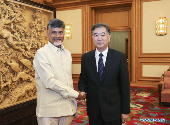 Chinese Vice Premier Wang Yang (R) meets with Nara Chandrababu Naidu, chief minister of Andhra Pradesh and President of Telugu Desam Party (TDP), in Beijing, capital of China, April 13, 2015. (Xinhua/Ding Lin) 
