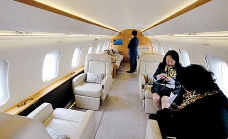 Visitors check out the cabin of a business jet at the 2015 Asian Business Aviation Conference & Exhibition, which opened at Shanghais Hongqiao International Airport yesterday. (Photo/Shanghai Daily)