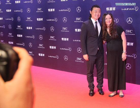 Retired Chinese tennis star Li Na (R) and her husband Jiang Shan pose on the red carpet for the Laureus World Sports Award ceremony at the Grand Theater in Shanghai on April 15, 2015. Li Na wins the Exceptional Achievement Award at the 16th Laureus World Sports Awards. (Photo: Xinhua/Chen Fei)