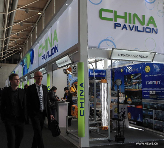 People visit a Chinese exhibitor's display booth at the Hanover Industrial Fair, in Hanover, Germany, on April 14, 2015. According to the Hanover Industrial Fair organizer, 56 percent of the exhibitors came from outside Germany. China, with more than 1100 exhibitors, is the second strongest exhibiting nation only next to Germany. (Xinhua/Luo Huanhuan)