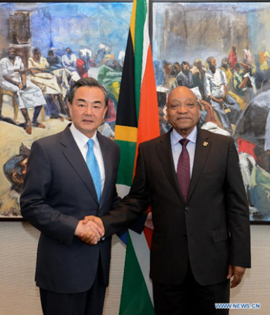 Visiting Chinese Foreign Minister Wang Yi(L) shakes hands with South African President Jacob Zuma during their meeting in Cape Town, South Africa, on April 15, 2015. South African President Jacob Zuma met visiting Chinese Foreign Minister Wang Yi in Cape Town on Wednesday, with the two sides vowing to strengthen industrial cooperation. (Xinhua/Zhai Jianlan)