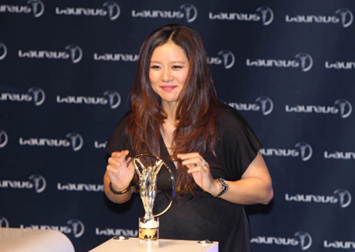 Latest honor: Retired tennis star Li Na is named winner of the Laureus Exceptional Achievement Award on Wednesday at the 2015 Laureus World Sports Awards in Shanghai. (Photo: GAO ERQIANG/China Daily)