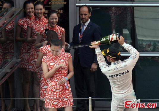 Mercedes AMG Petronas F1 Team's British driver Lewis Hamilton celebrates after winning the Formula One Chinese Grand Prix in Shanghai on April 12, 2015. Lewis Hamilton put Mercedes back on top with a win at the Chinese Grand Prix on Sunday. (Photo/CFP)