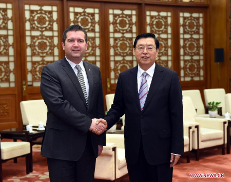 Zhang Dejiang (R), chairman of the Standing Committee of China's National People's Congress (NPC) and a member of the Standing Committee of the Political Bureau of the Communist Party of China (CPC) Central Committee, meets with Jan Hamacek, president of the chamber of deputies of the Czech Republic and also deputy president of the Czech Social Democratic Party, at the Great Hall of the People in Beijing, capital of China, April 20, 2015. (Xinhua/Rao Aimin)