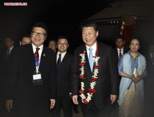 Chinese President Xi Jinping and his wife Peng Liyuan are welcomed upon their arrival in Jakarta, capital of Indonesia, April 21, 2015. Xi Jinping arrived in Indonesia late Tuesday for an Asian-African summit and commemorative activities for the historic 1955 Bandung Conference. (Xinhua/Li Xueren)
