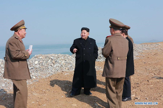 Photo provided by Korean Central News Agency (KCNA) on March 27, 2015 shows top leader of the Democratic People's Republic of Korea (DPRK) Kim Jong Un (2nd L) gives field guidance at the construction sites of the Kumsanpho Pickled-fish Processing Factory and the Kumsanpho Fishery Station recently in DPRK. (Xinhua/KCNA)