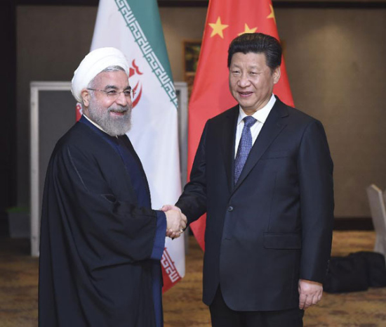 Chinese President Xi Jinping (R) meets with Iranian President Hassan Rouhani in Jakarta, capital of Indonesia, April 23, 2015. (Photo/Xinhua)