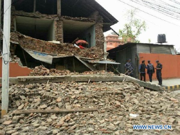 A collapsed building is seen in Nepal's capital Kathmandu April 25, 2015. An 8.1-magnitude earthquake struck Nepal, at 2:11 p.m. (Beijing Time) (0622 GMT) Saturday, China Earthquake Networks Center said. (Xinhua/Zhou Shengping)