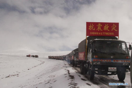 Trucks carrying relief materials head for quake-hit areas in southwest China's Tibet Autonomous Region, April 26, 2015. China is mobilizing all kinds of resources from rescue teams to relief supplies to the earthquake-hit Tibet Autonomous Region and the neighboring Nepal on the other side of the world's highest mountain. (Xinhua/Li Yuanhua)