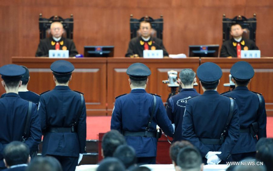 Prisoners on charges of jailbreak and intentional homicide stand trial at the Harbin Intermediate People's Court in Harbin, capital of northeast China's Heilongjiang Province, April 28, 2015. Gao Yulun, Wang Damin and Li Haiwei were tried for allegedly killing a prison guard and escaping a detention center in September 2014. (Xinhua/Wang Jiangwei)