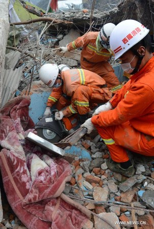 Rescuers work in the quake-hit Zham Town in Xigaze City, southwest China's Tibet Autonomous Region. Zham Town, one of the most seriously quake-hit areas in Tibet, has felt more than 20 aftershocks, which have caused landslides and avalanches. (Xinhua/Chogo)