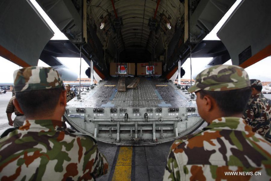 Nepalese army soldiers wait to arrange relief materials from China following Saturday's earthquake at Tribhuvan International Airport in Kathmandu, Nepal, April 28, 2015. (Xinhua/Pratap Thapa)