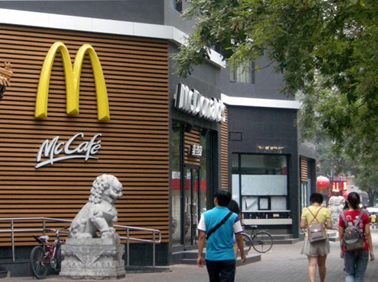 People walk past a McDonald's fast-food restaurant in Beijing. [Photo Provided to China Daily]