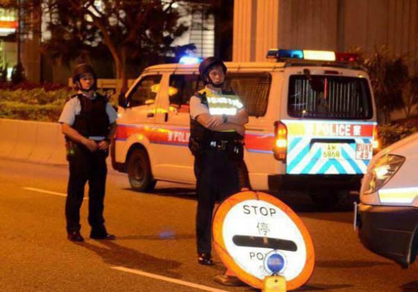 Police barricade a street as they carry out a manhunt for kidnappers in Hong Kong. (Photo/Xinhua)
