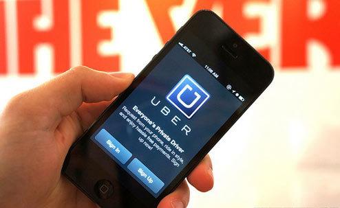 A file illustration picture shows the logo of car-sharing service app Uber on a smartphone. 