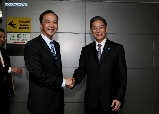 Zhang Zhijun (R), head of the Taiwan Work Office of the Communist Party of China (CPC) Central Committee, meets Eric Chu, Chairman of Taiwan's Kuomintang (KMT) Party, at the airport in east China's Shanghai, May 2, 2015. Chu arrived in Shanghai on Saturday for a cross-Strait forum. (Xinhua/Liu Ying) 