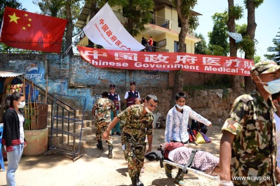 Members of Chinese Government Medical Team work at a tent hospital in Dhulikhel, Nepal, on May 3, 2015. China responded immediately to neighboring Nepal's call after the 7.9-magnitude quake hit the country. (Xinhua/Qin Qing)