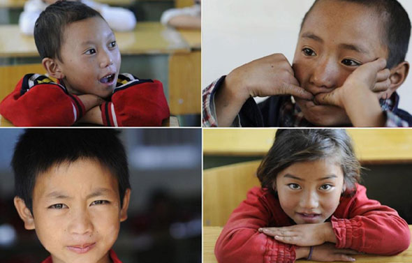 This file photo shows four children studying at the Suomahua school for orphaned children on August 27, 2010. China is raising the amount of financial assistance for fostered and abandoned children in both rural and urban areas. (File Photo/Xinhua)