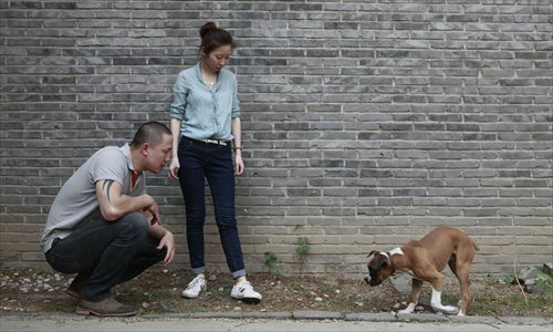 Expert warns that DINK families who devote too much to raising their pets may have negative psychological effects when the animals die. (Photo: GT/Li Hao)