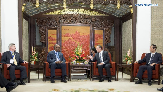 Wang Qishan (2nd R), a member of the Standing Committee of the Political Bureau of the Communist Party of China (CPC) Central Committee and secretary of the CPC Central Commission for Discipline Inspection (CCDI), meets with a U.S. delegation composed of members from the Democratic Party and the Republican Party, in Beijing, capital of China, May 7, 2015. (Xinhua/Wang Ye)