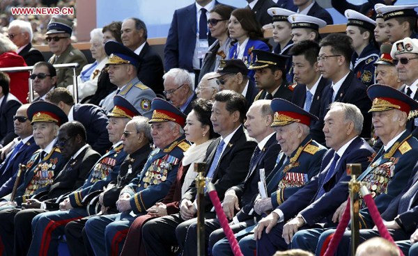 Chinese President Xi Jinping (5th R, front) and his wife Peng Liyuan attend a grand military parade to mark the 70th anniversary of the victory of the Great Patriotic War, with Russian President Vladimir Putin and other leaders, in Moscow, Russia, May 9, 2015. (Xinhua/Ju Peng) 