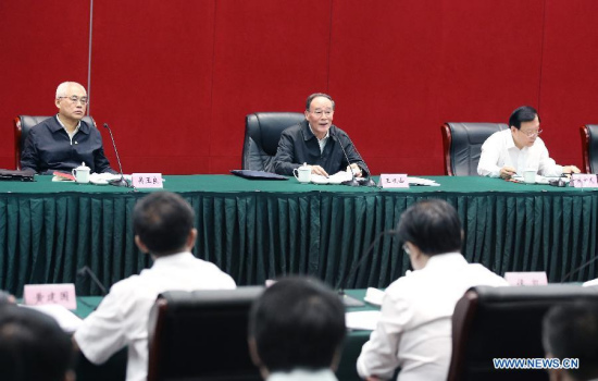 Wang Qishan (C, rear), a member of the Standing Committee of the Political Bureau of the Communist Party of China (CPC) Central Committee and secretary of the CPC Central Commission for Discipline Inspection (CCDI), presides over a symposium of local secretaries of the CPC Discipline Inspection in Jiaxing, east China's Zhejiang Province, May 9, 2015. Wang made an inspection tour in Zhejiang from May 8 to 10. (Xinhua/Yao Dawei)