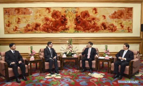 Meng Jianzhu (2nd R), head of the Commission for Political and Legal Affairs of the Communist Party of China Central Committee, meets with Hong Kong's new Police Commissioner Stephen Lo (2nd L) in Beijing, capital of China, May 19, 2015. (Xinhua/Xie Huanchi)