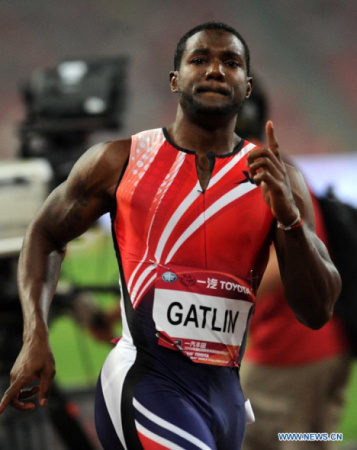 Justin Gatlin of the United States celebrates after winning the men's 100 meters at the IAAF World Challenge Beijing, China, May 21, 2014. Justin Gatlin finished the match in 9.87 seconds and claimed the title of the event. (Xinhua/Gong Lei)