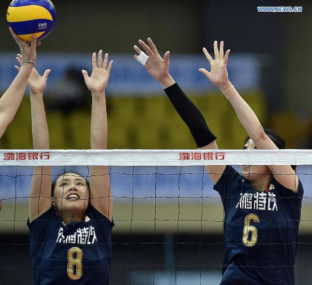 Zeng Chunlei (L) and Yang Junjiang of China block the ball during the match against Vietnam at the 18th Asian Senior Women's Volleyball Championships in Tianjin, north China, on May 24, 2015. China won 3-0. (Xinhua/Yue Yuewei)