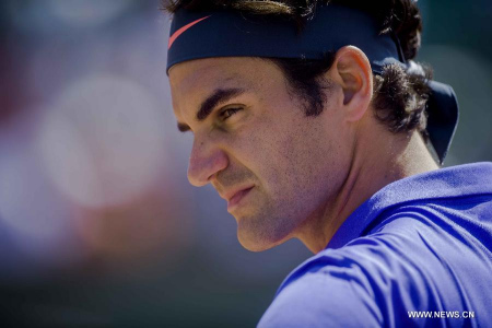 Roger Federer of Switzerland reacts during the men's singles first round match against Alejandro Falla of Colombia at Roland Garros, Paris, France on May 24, 2015. Roger Federer won 3-0 and advanced to the second round. (Xinhua/Chen Xiaowei)