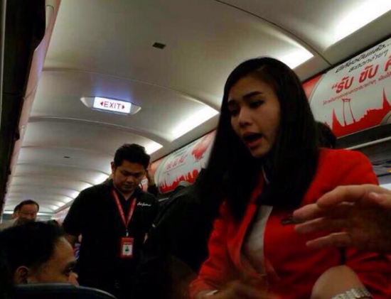 A Thai flight attendant seen in this photo during a scuffle, Dec 12, 2014. (Photo provided on Weibo)