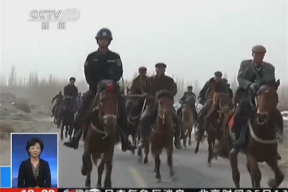 A screenshot from CCTV shows police and local farmers on horses tracking down the terrorists.