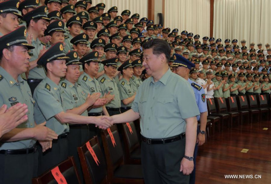 Chinese President Xi Jinping, also general secretary of the Communist Party of China (CPC) Central Committee and chairman of the Central Military Commission, meets with senior officers of Zhejiang Military Area Command during an inspection tour in east China's Zhejiang Province, May 26, 2015. (Xinhua/Li Gang)