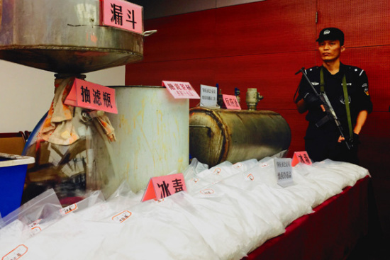 Guangdong police show seized methamphetamine in Guangzhou on Thursday. A total of 48 suspects, including two Taiwan residents, were detained. (Photo: Zhou Wei/for China Daily)