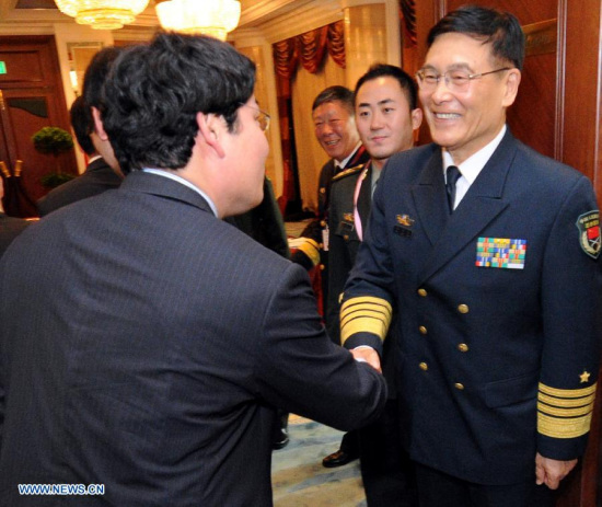 Admiral Sun Jianguo (R), vice chief of staff of China's People's Liberation Army (PLA), meets with Hideshi Tokuchi, Japanese vice minister of Defense for International Affairs, on the sidelines of the 14th Shangri-La Dialogue in Singapore, on May 29, 2015. (Xinhua/Then Chih Wey)