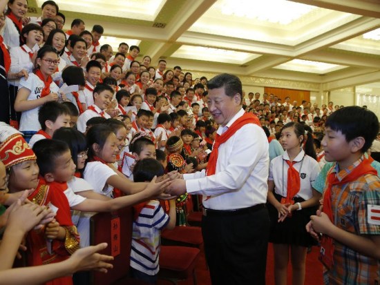 Chinese President Xi Jinping meets with representatives attending the 7th National Congress of the Chinese Young Pioneers in Beijing, capital of China, June 1, 2015. Senior leader of the Communist Party of China Liu Yunshan also joined the meeting. (Xinhua/Ju Peng)