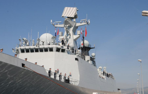 Chinese navy soldiers wave hands on the deck of Linyi missile frigateas it sits docked in the port of Rola, Sprit, Croatia, June 1, 2015. The 19th Chinese naval escort fleets started a five-day goodwill visit to Croatia on Monday. (Xinhua/Xue Qun)