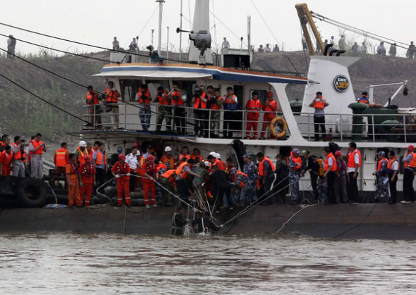 A senior woman is saved from the water near the capsized ship Eastern Star, which overturned in the Jianli section of the Yangtze River in Hubei province, on Monday night. (Photo/Xinhua)