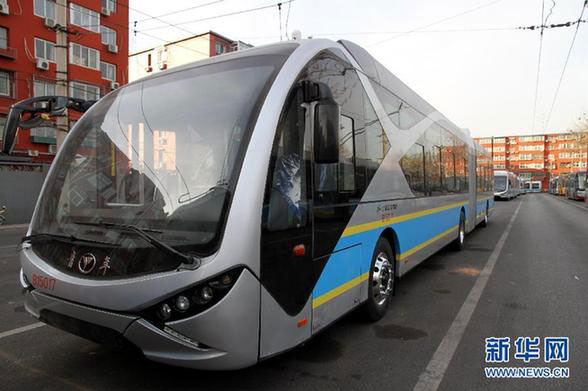 Photo taken on March 23, 2015 shows a new energy public bus at a bus terminal in Beijing. (Photo/Xinhua)