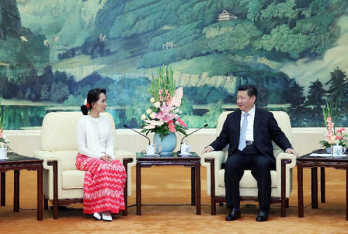 Chinese President Xi Jinping (R) meets with a delegation from Myanmar's National League for Democracy (NLD), headed by NLD chairperson Aung San Suu Kyi, at the Great Hall of the People in Beijing, China, June 11, 2015. (Photo/Xinhua)