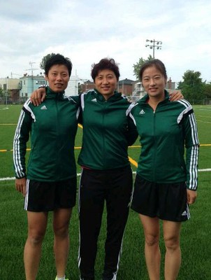 Qin Liang (L)and the other two Chinese referees.