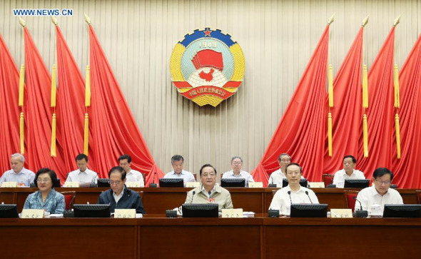 Yu Zhengsheng (C front), Chairman of the Chinese People's Political Consultative Conference (CPPCC) National Committee, presides over the 11th meeting of the Standing Committee of the CPPCC National Committee in Beijing, capital of China, June 16, 2015. The meeting was mainly to discuss the mapping of the nation's 13th Five-Year Plan. (Photo: Xinhua/Yao Dawei)