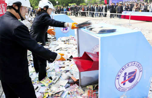 Pirated copies of books, audio and video products, as well as software, were destroyed during a crackdown in Weinan, Shaanxi province, in April. (Photo: Yuan Jingzhi/for China Daily)