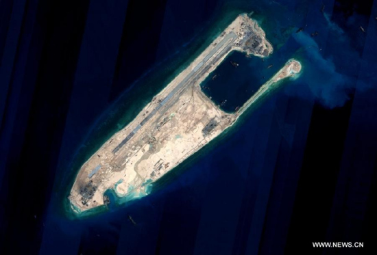 Satellite image shows the Yongshu reef of the Nansha Islands after a land reclamation project in south China. The land reclamation project of China's construction on some stationed islands and reefs of the Nansha Islands will be completed, as planned, in the upcoming days, according to relevant Chinese competent departments. (Photo/Xinhua)