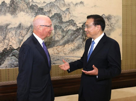 Chinese Premier Li Keqiang (R) meets with Klaus Schwab, founder and executive chairman of the World Economic Forum, in Beijing, capital of China, June 17, 2015. (Photo: Xinhua/Pang Xinglei)