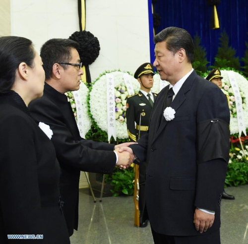 Chinese President Xi Jinping (R) shakes hands with a family member of Qiao Shi, former chairman of the National People's Congress (NPC) Standing Committee, while attending Qiao's funeral in Beijing, capital of China, June 19, 2015. Qiao Shi was cremated Friday. (Xinhua/Rao Aimin) 