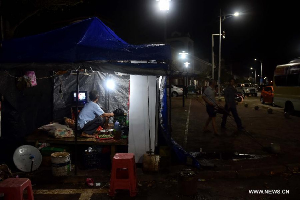A stall by the street opens for business in Gangbei Harbor under Hele Town of Wanning City, south China's Hainan Province, June 22, 2015. Typhoon Kujira, the eighth typhoon of 2015, made landfall in the coastal city of Wanning at 6:50 p.m., packing winds of up to 90 kilometers per hour, said the Hainan Meteorological Service. (Photo: Xinhua/Guo Cheng)